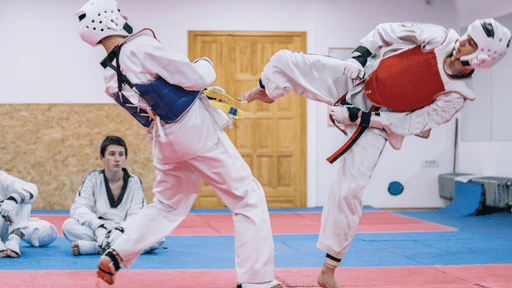 Two taekwondo players fighting